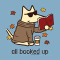 A stylized cartoon dog wearing sunglasses and a brown sweater sits on a light blue background, reading a red book with autumn leaves floating around it and the text 'all booked up' below.