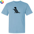 A light blue short-sleeve crewneck t-shirt featuring a black graphic of a sitting dog silhouette with the text 'all dogs are good dogs' and a small paw print.