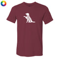 A maroon short-sleeve crewneck t-shirt with a white graphic of a dog silhouette containing the text 'all dogs are good dogs' and a small paw print. A multicolor color wheel icon is visible in the top-left corner.