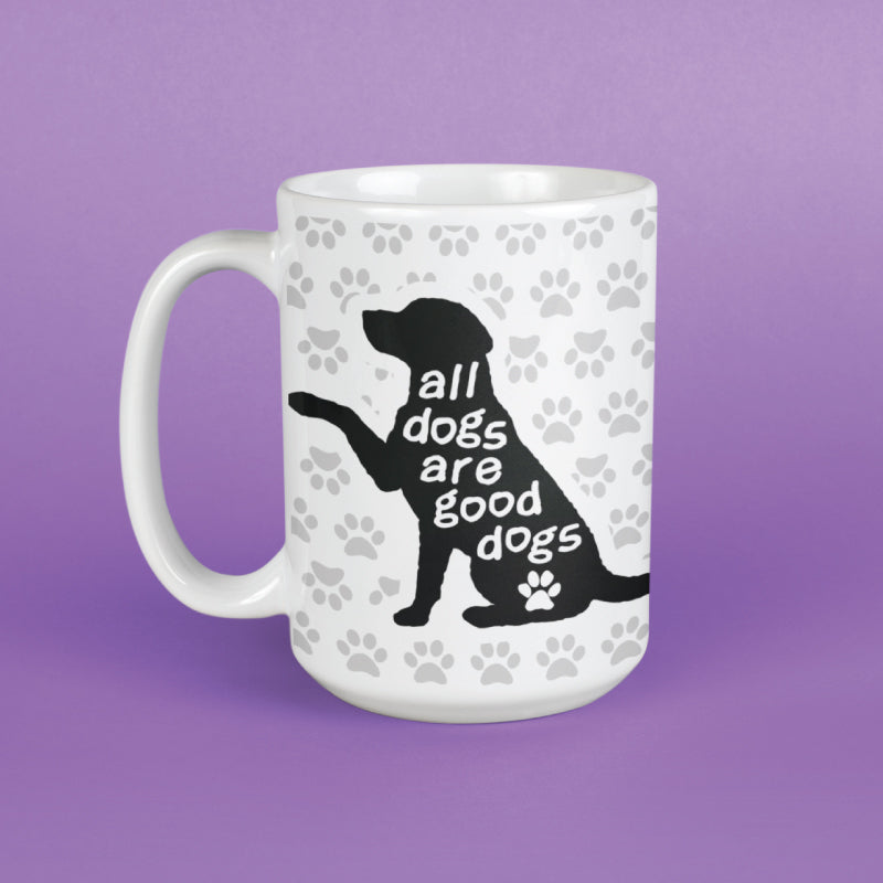 A white ceramic mug with a black silhouette of a dog and the text 'all dogs are good dogs' on a purple background.
