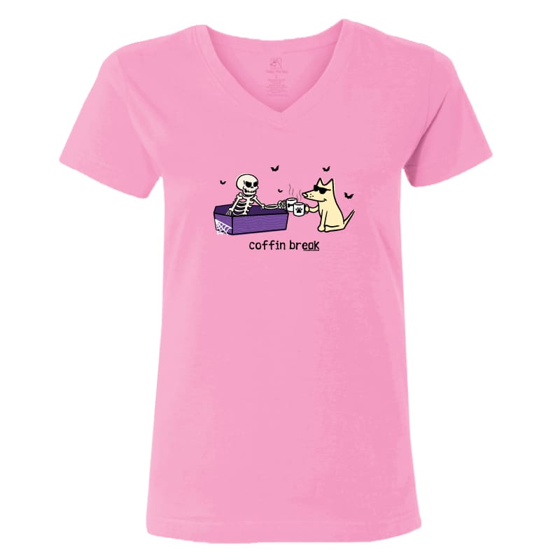 A pink women's V-neck t-shirt featuring a cartoon graphic of a skeleton in a coffin and a dog drinking from a cup, with the text 'coffin break' printed below.