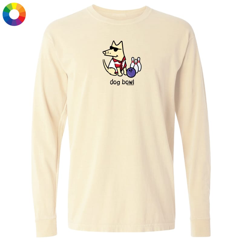 A cream-colored long-sleeve t-shirt with a cartoon graphic of a dog bowling, shown on a plain white background. The shirt features a small graphic of a cartoon dog wearing sunglasses and a red shirt, bowling with pins and a ball, with the text 'dog bowl' underneath.