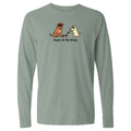 Green long-sleeve shirt with a graphic of two dogs and text on a white background
