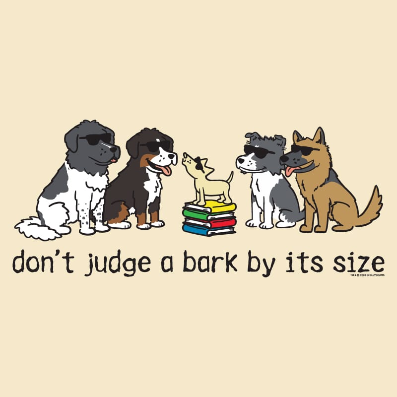 A beige graphic print featuring five cartoon dogs wearing sunglasses, with one small dog standing on a stack of colorful books. Below the illustration, the text reads 'don't judge a bark by its size' in black lowercase letters.