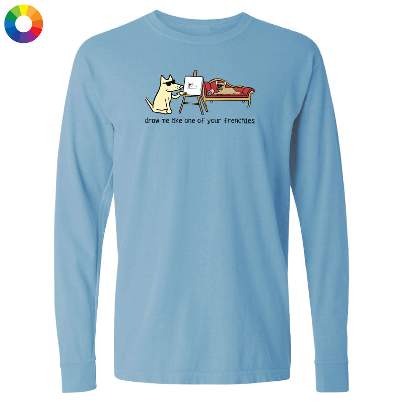 Light blue long-sleeve shirt with a cartoon design of a dog drawing another dog on a white background.