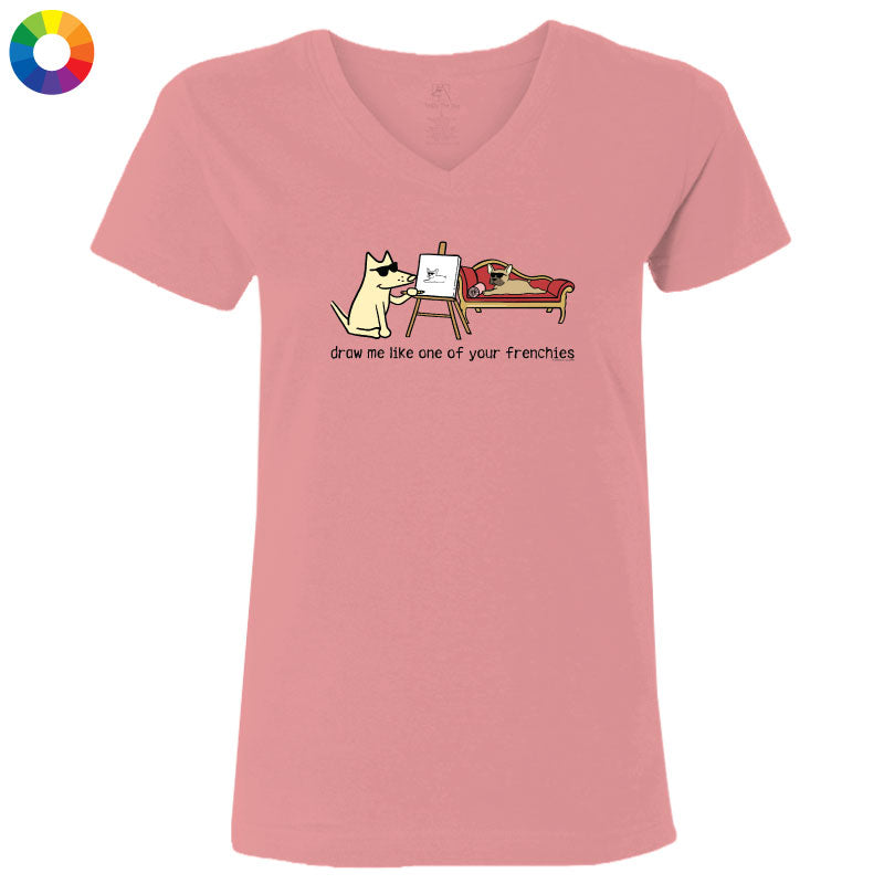 Pink t-shirt with a cartoon design of a cat drawing a dog, on a white background.