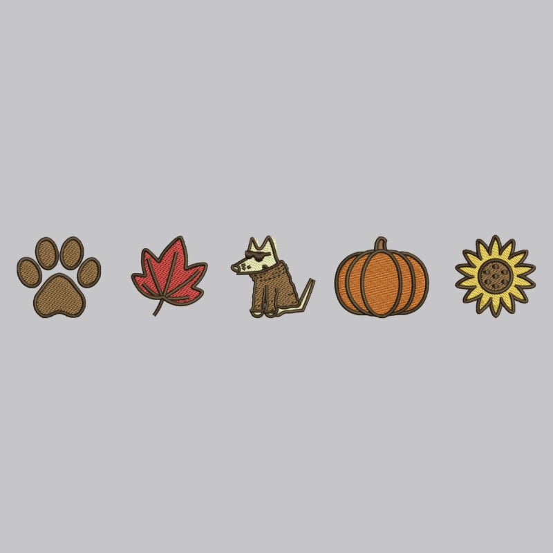 Five autumn-themed embroidered patch designs arranged in a row on a solid gray background: a brown paw print, a red maple leaf, a brown and cream dog wearing a coat, an orange pumpkin, and a yellow sunflower.