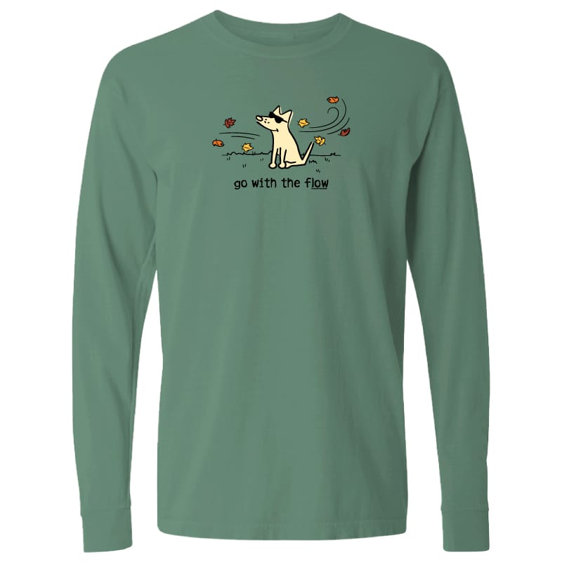 A sage green long-sleeve t-shirt with a cartoon graphic of a dog surrounded by flowers and the text 'go with the flow!' printed on the chest, displayed on a solid white background.