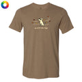 A brown short-sleeve crewneck t-shirt with a graphic of a white cat surrounded by autumn leaves and the text 'go with the flow' on the chest, displayed on a solid white background.