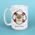 Mug with a dog illustration and 'good buoy' text on a blue background