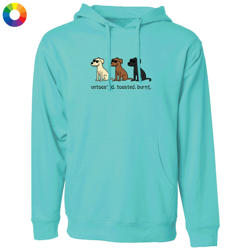 A turquoise pullover hoodie with a graphic of three dogs and the text 'uncoated, toasted, burnt.' on the chest, shown on a plain white background.