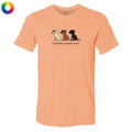 A peach-colored short-sleeve t-shirt with a graphic of three dogs and the text 'untasted. toasted burnt.