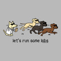 A cartoon graphic on a light gray background showing four dogs running from left to right, each wearing sunglasses. One dog on the left is a cat dressed as a lab coat, while the others are dogs.