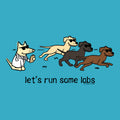A graphic design featuring three cartoon dogs wearing sunglasses running across a bright blue background, with a white dog on the left dressed in a lab coat and stethoscope. Below the illustration, the text reads 'let's run some labs' in black lowercase letters.