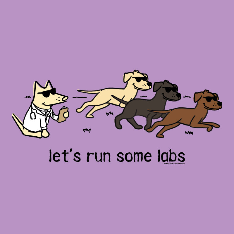 A purple graphic print featuring three cartoon dogs wearing sunglasses running, with a white dog on the left in a lab coat holding a bottle. Below the dogs, the text reads 'let's run some labs' in black lowercase letters.