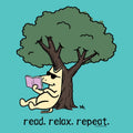 A cartoon illustration of a cream-colored cat sitting under a large green tree and reading a pink book, with the text 'read. relax.