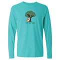 A turquoise long-sleeve crewneck t-shirt with a cartoon graphic of a dog running under a tree and the text 'read. relax.