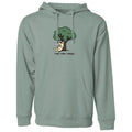 A sage green pullover hoodie with a front kangaroo pocket and drawstrings, featuring a cartoon graphic of a dog under a tree with the text 'read, relax, repeat.' on the chest.