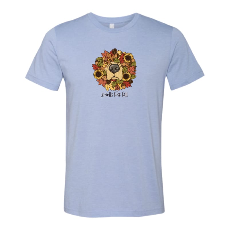 A light blue heather crewneck t-shirt featuring a graphic of a dog's face surrounded by autumn leaves and sunflowers, with the text 'smells like fall' printed below.