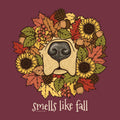 A circular autumn-themed illustration featuring a dog nose surrounded by sunflowers, fall leaves, acorns, and pinecones, with the text 'smells like fall' below on a solid dark burgundy background.