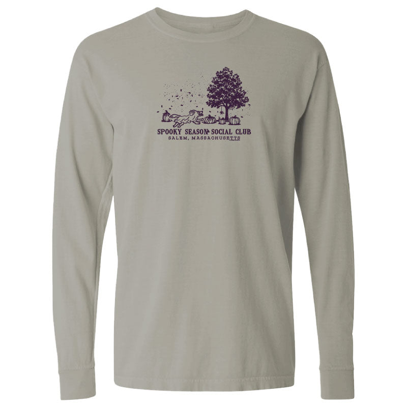 A light gray long-sleeve t-shirt with a dark purple graphic on the chest depicting a tree, a ghost, a mug, and the text 'SPOOKY SEASON SOCIAL CLUB' and 'BOSTON, MASSACHUSETTS'.