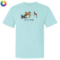 Light blue t-shirt with cartoon dogs and text on a white background