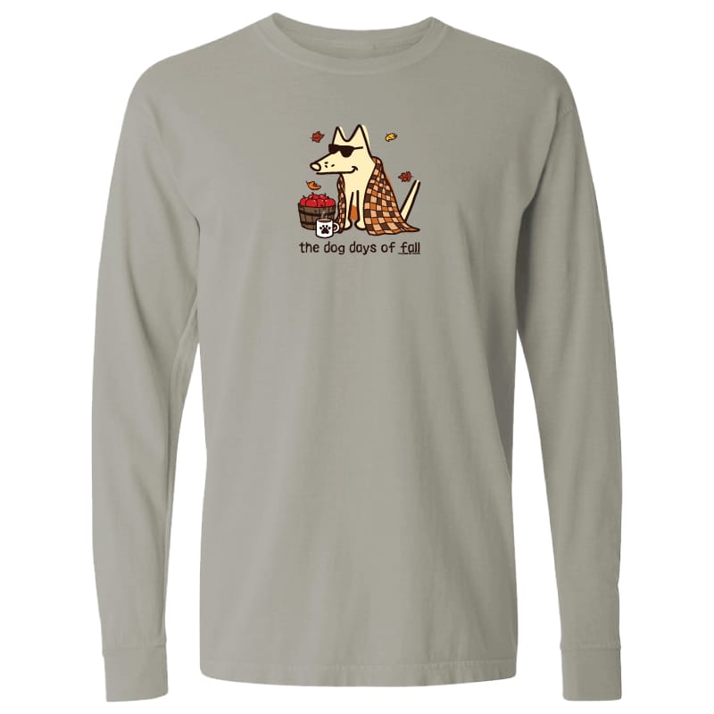 A light gray long-sleeve crewneck t-shirt featuring a cartoon graphic of a dog wearing sunglasses and a plaid blanket, sitting next to a cup of coffee with the text 'The dog days of Fall' printed below.
