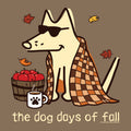 A stylized fall-themed illustration of a cream-colored dog wearing black sunglasses, wrapped in an orange and brown plaid blanket, sitting beside a basket of red apples and a white mug with a black paw print. The text 'the dog days of fall' appears at the bottom on a solid brown background.