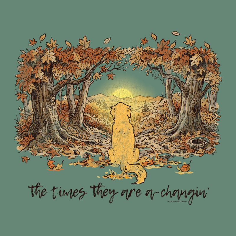 A square graphic print featuring a golden retriever dog sitting in a forest of autumn trees, looking toward a glowing sunset. The text 'the times they are a-changin'' is written in cursive at the bottom.