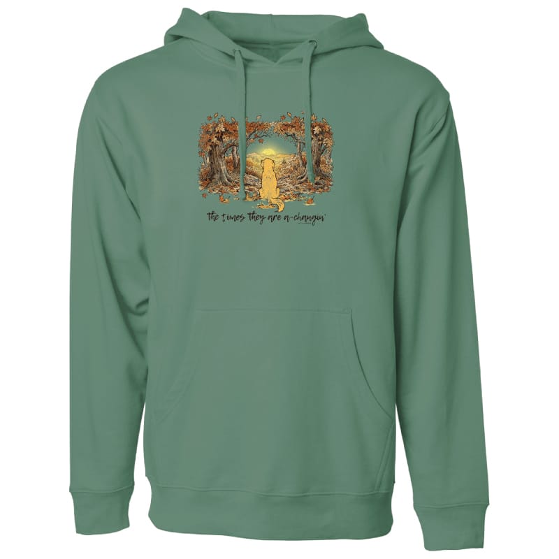 A sage green pullover hoodie with a front kangaroo pocket and drawstring hood, featuring a graphic print of a golden retriever framed by autumn trees with the text 'The times they are a-changin'' on the chest.