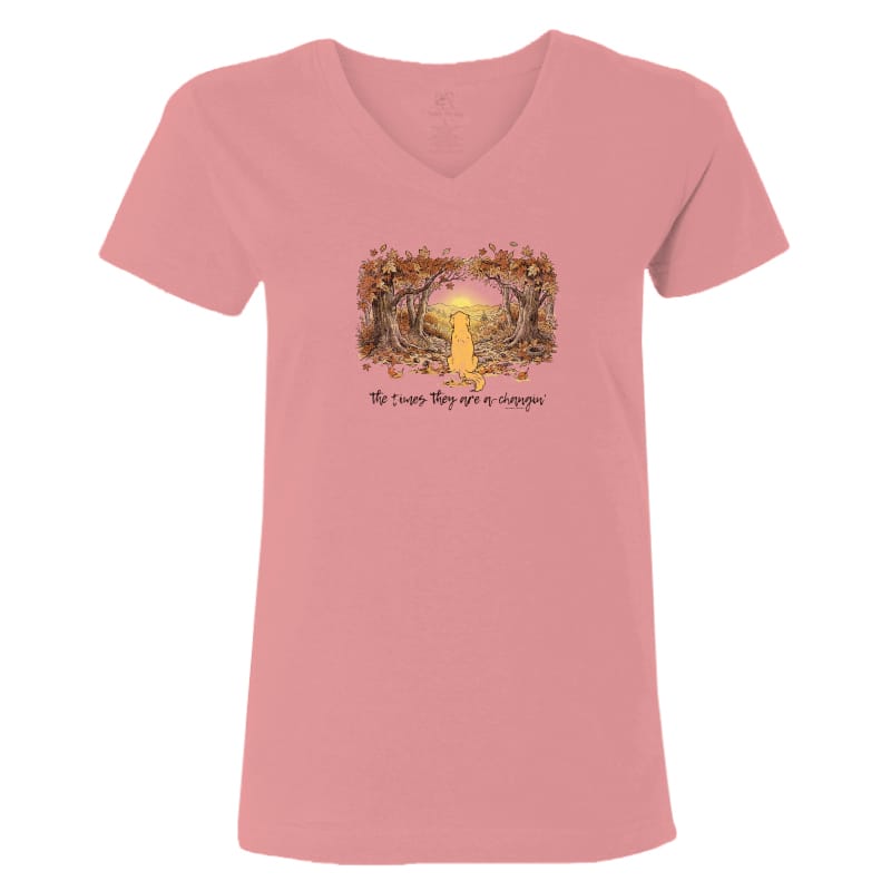 A pink short-sleeve V-neck t-shirt with a central graphic of a yellow dog sitting in a forest with the text 'The dogs they are a family' printed below it, shown on a plain white background.