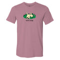 A heathered dusty rose short-sleeve t-shirt with a cartoon graphic of a dog rolling in green grass and the text 'touch grass' printed on the chest.