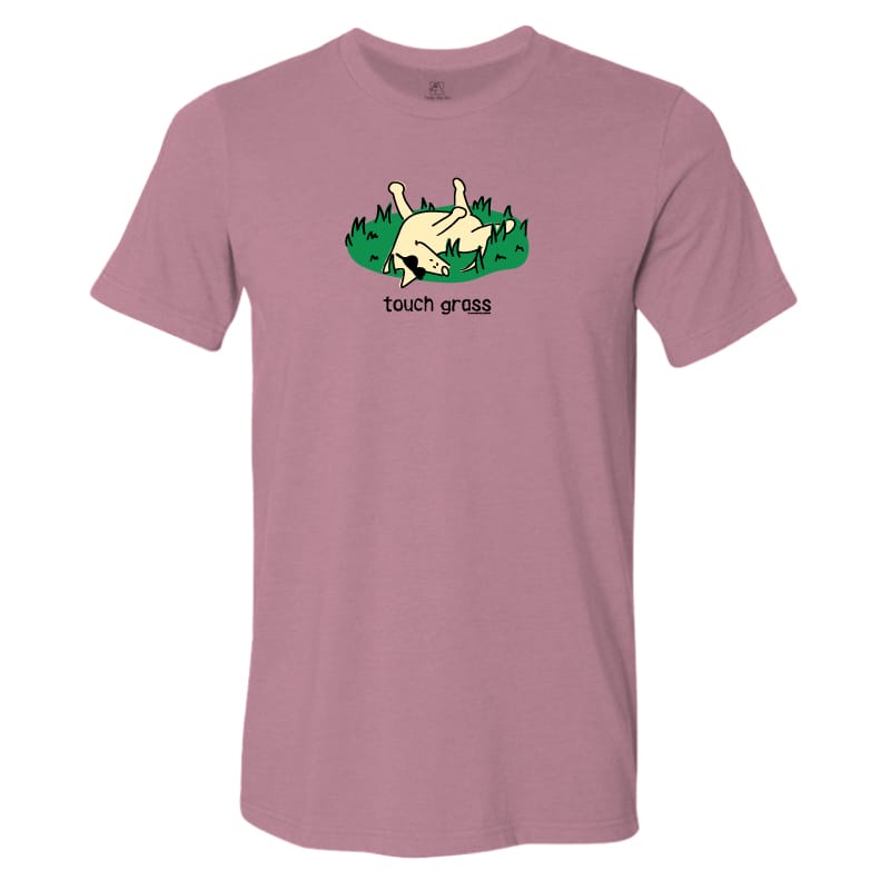 A heathered dusty rose short-sleeve t-shirt with a cartoon graphic of a dog rolling in green grass and the text 'touch grass' printed on the chest.