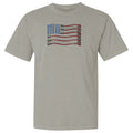 Beige t-shirt with a graphic of an American flag on a white background