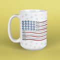 White mug with American flag design on a yellow background
